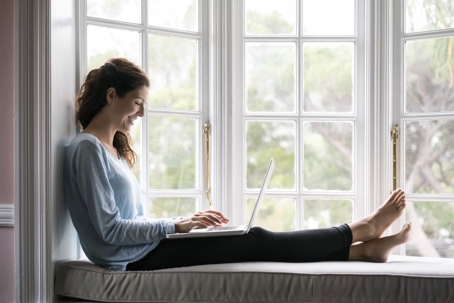 Woman sitting on a window seat
